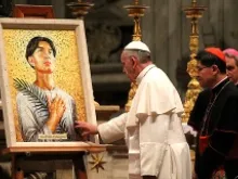 Pope Francis takes a moment to pray before the mosaic of St. Pedro Calungsod in St. Peter's Basilica Nov. 21, 2013. 