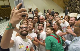 Pope Francis takes a selfie with members of the International Eucharistic Youth Movement in the Vatican's Paul VI Hall, Aug. 7, 2015.   L'Osservatore Romano.