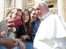 Pope Francis takes a selfie with pilgrims at the April 1, 2015 general audience in St. Peter’s Square.