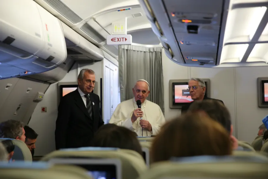 Pope Francis speaks with journalists aboard the plane to Manila, Jan. 15, 2015. ?w=200&h=150