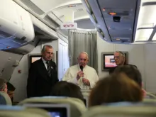 Pope Francis speaks with journalists aboard the plane to Manila, Jan. 15, 2015. 