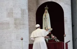 Pope Francis touches a statue of Our Lady of Fatima at an Oct. 12 vigil in St. Peter's Square. ?w=200&h=150