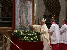 Pope Francis venerates an image of Our Lady of Guadalupe while saying Mass in St. Peter's Basilica, Dec. 12, 2014. 