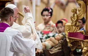 Pope Francis uncovers the Child Jesus in St. Peter's Basilica Dec. 24, 2019.   Daniel Ibanez/CNA.