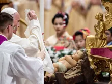 Pope Francis uncovers the Child Jesus in St. Peter's Basilica Dec. 24, 2019. 
