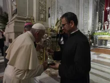 Pope Francis venerates a relic at the Palermo cathedral during his encounter with clerics, religious, and seminarians, Sept. 15, 2018. 