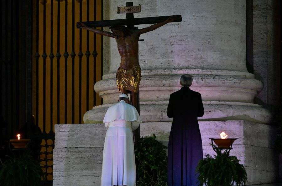 Pope Francis venerates the miraculous crucifix of San Marcello al Corso in St. Peter's Square during his Urbi et Orbi blessing, March 27, 2020. Vatican Media.