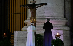 Pope Francis venerates the miraculous crucifix of San Marcello al Corso in St. Peter's Square during his Urbi et Orbi blessing, March 27, 2020.   Vatican Media.