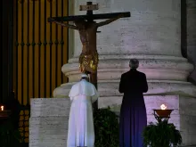 Pope Francis venerates the miraculous crucifix of San Marcello al Corso in St. Peter's Square during his Urbi et Orbi blessing, March 27, 2020. 