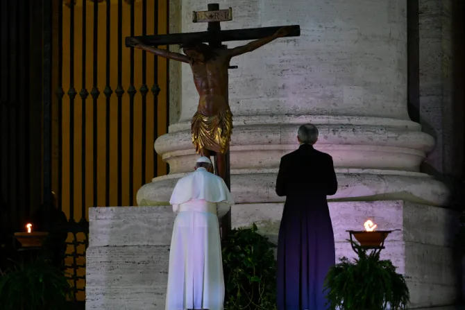 Pope Francis venerates the miraculous crucifix of San Marcello al Corso in St Peters Square during his Urbi et Orbi blessing March 27 2020 Credit Vatican Media