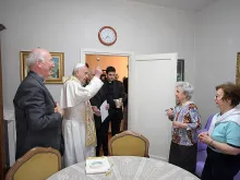 Pope Francis blesses a home in Ostia, Italy, May 19, 2017. 