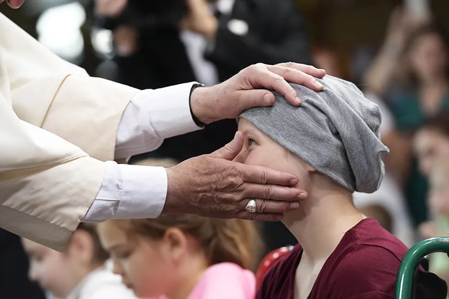 Pope Francis embraces a patient at Krakow's Prokocim University Pediatric Hospital, July 29, 2016. ?w=200&h=150