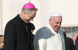 Pope Francis walks with Archbishop Georg Ganswein in St. Peter's Square during his Wednesday general audience on Dec. 4, 2013 ?w=200&h=150