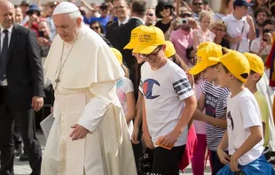 Pope Francis walks with young people during his general audience June 13, 2018.   Marina Testino/CNA.