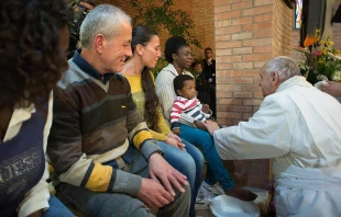 Pope Francis performing the rite of the washing of feet at a Holy Thursday Mass said at Rebibbia prison, Rome, April 2, 2015.   L'Osservatore Romano.