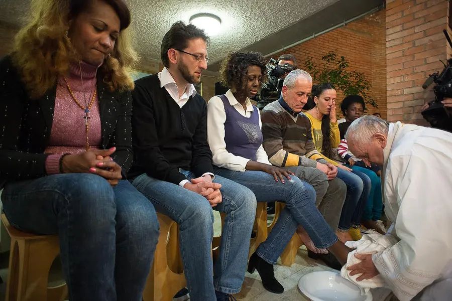 Pope Francis performing the rite of the washing of feet at a Holy Thursday Mass said at Rebibbia prison, Rome, April 2, 2015. ?w=200&h=150