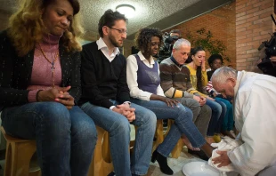 Pope Francis performing the rite of the washing of feet at a Holy Thursday Mass said at Rebibbia prison, Rome, April 2, 2015.   L'Osservatore Romano.