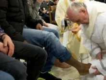 Pope Francis washes the feet of a juvenile detainee at Casal del Marmo on March 28, 2013. 
