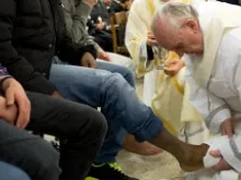 Pope Francis washes the feet of a prisoner at Rome's Casal Del Marmo Youth Detention Centre on Holy Thursday, March 28, 2013. 