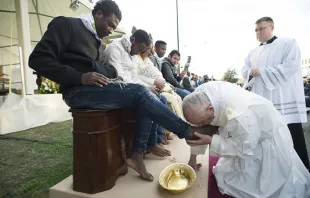 Pope Francis washes the feet of migrants and refugees during Holy Thursday Mass March 24, 2016.   L'Osservatore Romano.