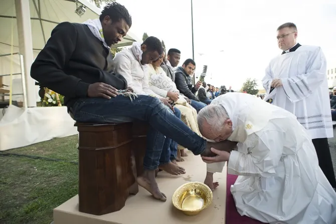 Pope Francis washes the feet of migrants and refugees during Holy Thursday Mass March 24 2016 Credit LOsservatore Romano CNA