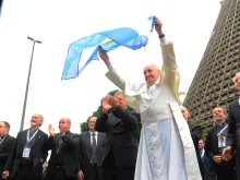 Pope Francis waves an Argentine flag July 25, 2013. 