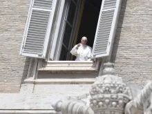 Pope Francis waves from a window of the apostolic palace May 10, 2020. 