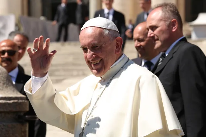 Pope Francis waves to pilgrims in St Peters Square during his April 20 2016 general audience Credit Daniel Ibez CNA
