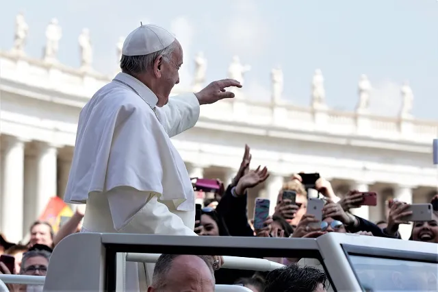 Pope Francis waves to pilgrims in St. Peter's Square on Easter Sunday April 16, 2017. ?w=200&h=150