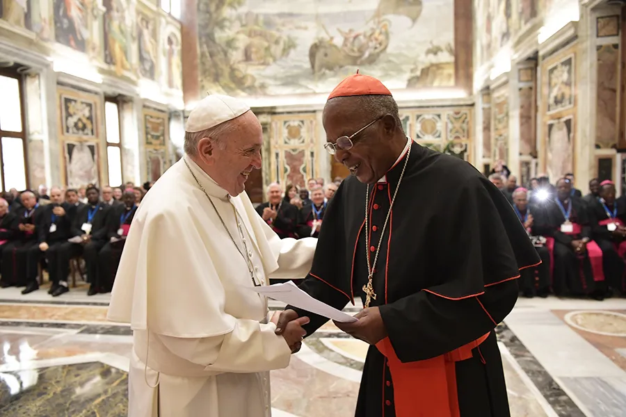Pope Francis greets Cardinal John Njue of Nairobi, president of the International Catholic Migration Commission, at the Vatican's Clementine Hall, March 8, 2018. ?w=200&h=150