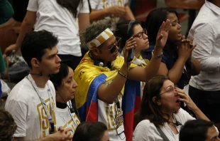 Youth from the Shalom Catholic Community pray during an audience with Pope Francis in the Pope Paul VI Hall on Sept. 4.   Daniel Ibanez/CNA