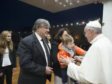 Pope Francis greets a family at a prayer vigil for the Synod on the Family, Oct. 3, 2015. 