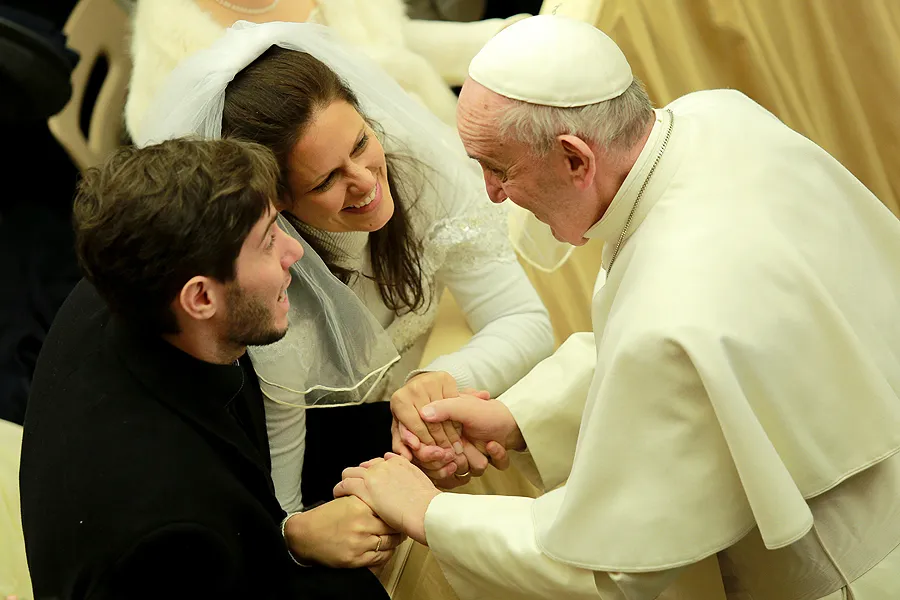 Pope Francis greets a newly married couple in the Vatican's Paul VI Hall, Jan. 20, 2016. ?w=200&h=150