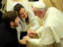 Pope Francis greets a newly married couple in the Vatican's Paul VI Hall, Jan. 20, 2016. 
