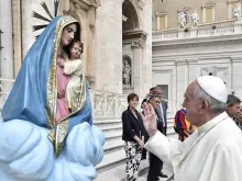 Pope Francis with a statue of Mary and baby Jesus in St. Peter's Square during the general audience on Sept 9, 2015. 