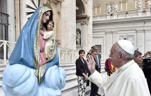 Pope Francis with a statue of Mary and baby Jesus in St. Peter's Square during the general audience on Sept 9, 2015.   Vatican Media.