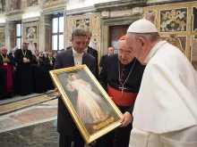 Pope Francis is presented with an image of the Divine Mercy by the John Paul II Foundation, April 25, 2015. 