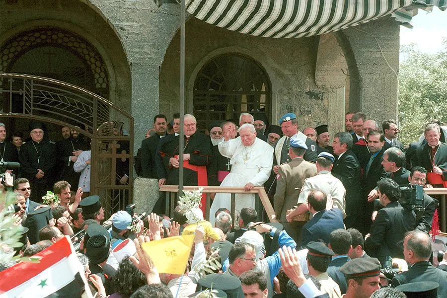 Pope John Paul II, center, waves to a crowd of wellwishers May 7, 2001 during a visit to the demilitarized city of Qunaitra, Syria in the Golan Heights. ?w=200&h=150