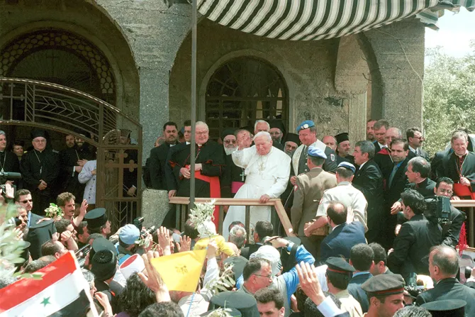 Pope John Paul II center waves to a crowd of wellwishers May 7 2001 during a visit to the demilitarized city of Qunaitra Syria in the Golan Heights  Credit Courtney   Kealy   Newsmakers  Getty Images CNA 1