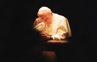 St. John Paul II in prayer, c. 1991.   L'Osservatore Romano.