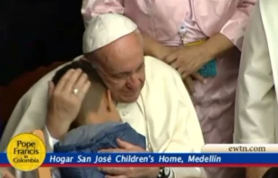Pope Francis embraces a child at the St. Joseph Children's Home in Medellin, Colombia Sept. 9, 2017.