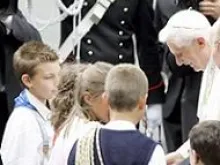 Pope Benedict greets children in mountain vacation town