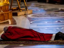 Pope Francis prostrates himself before the altar of St. Peter's Basilica at the opening of the Good Friday liturgy April 19, 2019. 