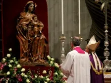 Pope Francis stands before a statue of Mary in St. Peter's Basilica on Nov. 30, 2013. 