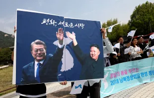 Posters of South Korean President Moon Jae-In and North Korean leader Kim Jong-Un during a rally on April 26, 2018 in Seoul.   Chung Sung-Jun/Getty Images.