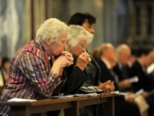 Catholics pray in church. 