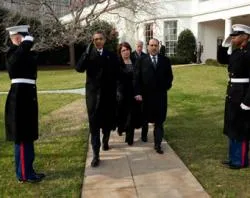 President Barack Obama, accompanied by Iraqi Prime Minister Nouri al-Maliki, salutes as he departs the White House, Dec. 12, 2011. ?w=200&h=150
