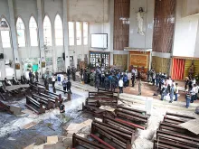 An inspection of Our Lady of Mount Carmel Cathedral in Jolo, Philippines, Jan. 28, 2019, a day after suicide bombs exploded at the church. 