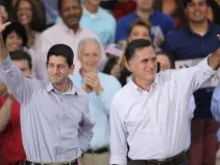 Mitt Romney and Paul Ryan (L) greet supporters during a campaign event at the Waukesha Expo Center on August 12, 2012 in Waukesha, Wis. 