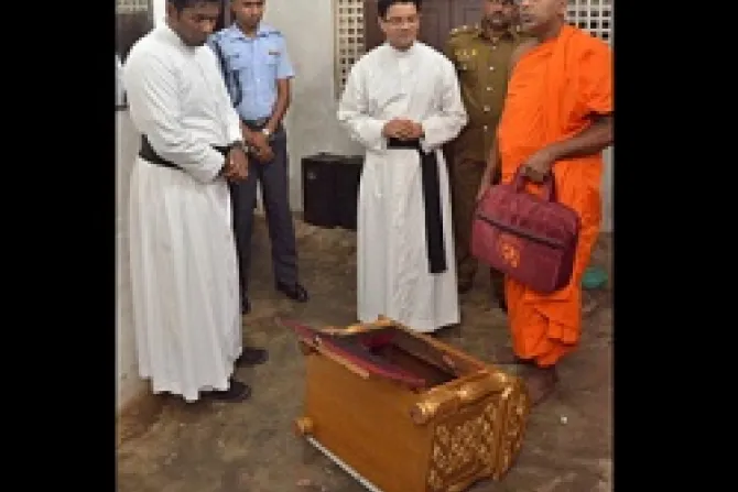 Priests a Buddhist monk and police inspecting the desecrated tabernacle Credit Fr Sunil De Silva Archdiocese of Colombo CNA 7 24 13